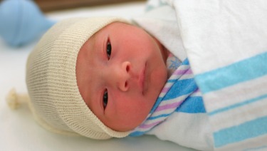 Newborn infant in hospital.